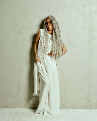 Oversized Wide-Leg Pants Designed for a relaxed fit that moves fluidly, these pants bring a quiet confidence to any look. The pleats at the front add definition to the wide-leg silhouette, creating a balance between structure and ease. Whether paired with