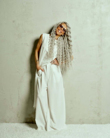 Oversized Wide-Leg Pants Designed for a relaxed fit that moves fluidly, these pants bring a quiet confidence to any look. The pleats at the front add definition to the wide-leg silhouette, creating a balance between structure and ease. Whether paired with