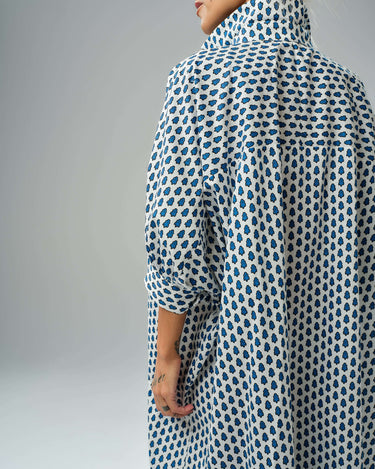 Back view of an oversized shirt dress with blue micro floral print, perfect for relaxed comfort and style.