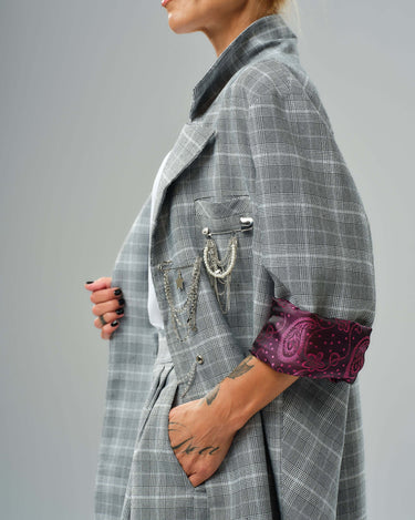 Light grey checked oversized blazer with decorative chain detail and burgundy paisley lining.