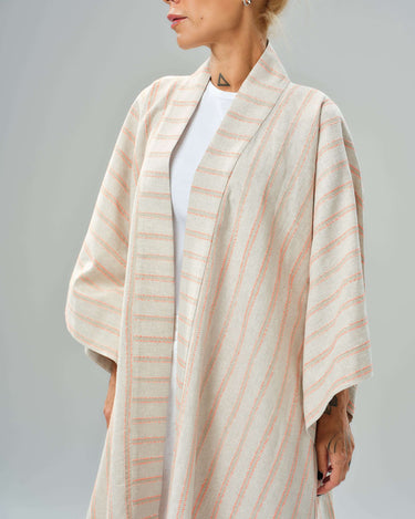 Handmade striped linen-cotton kimono draping elegantly on a model, perfect for stylish layering.