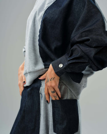 Close-up of Grey and Denim Co-Ord Set showcasing relaxed sweatshirt with asymmetric sleeve and denim panel details.