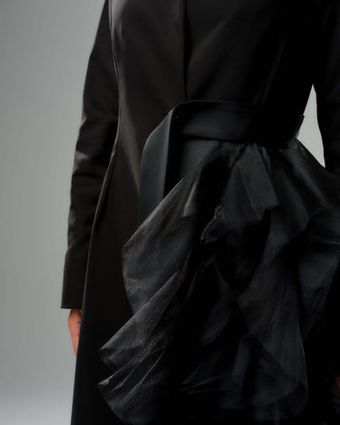 Black tulle detail blazer with asymmetric tulle accent and satin waist belt, showcasing bold evening wear style.