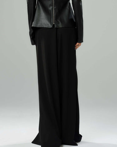 Stylish black wide-leg pants with a flowing silhouette and wrap-effect front, perfect for elegant day or evening wear.