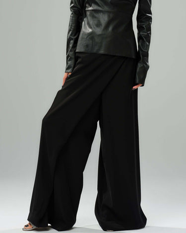 Elegant black wide-leg pants featuring a wrap-effect front and perfect for day or evening styling.