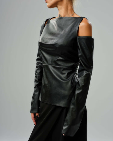 Sleek black faux leather top with cut-out shoulders and long sleeves, perfect for modern, edgy outfits.