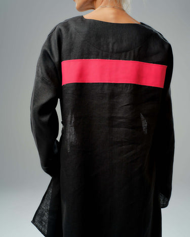 Back view of a black tunic featuring a striking red leather stripe, showcasing modern and minimalistic design.