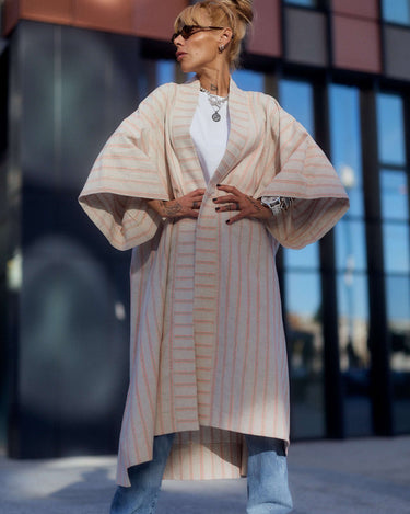 Model wearing a Striped Linen-Cotton Kimono over a casual outfit, showcasing its elegant drape and relaxed fit.