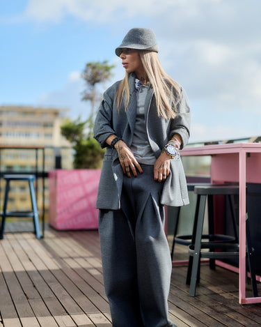 Gray Oversized Blazer worn by a fashionable model outdoors, showcasing a minimalistic yet sculptural silhouette.