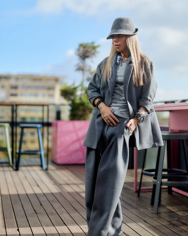 Gray Wide-Leg Structured Pants paired with a stylish blazer and hat, showcasing urban fashion aesthetics.