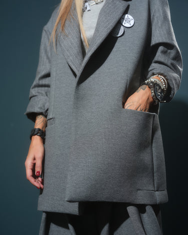 Gray Oversized Blazer featuring a relaxed fit, dropped shoulders, and discreet front pockets.