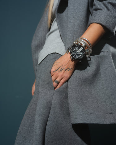Gray Oversized Blazer worn with stylish accessories, showcasing a strong and refined look.