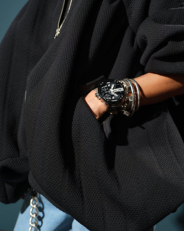Black Oversized Textured Jacket worn with layered bracelets and a stylish watch, showcasing modern streetwear flair.