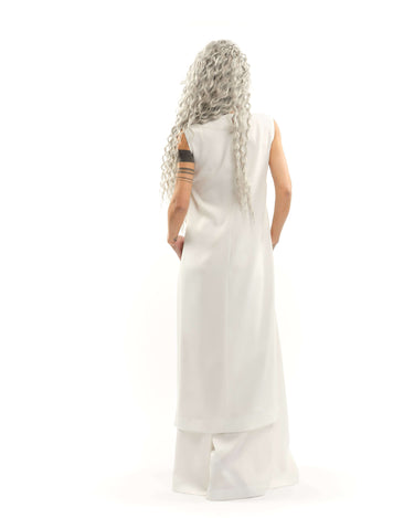 Sleeveless Maxi Tunic Suspended from barely-there straps that crisscross and tie at the back, this dress drapes fluidly, catching movement with every step. The midi length strikes the perfect balance between elegance and ease. FEATURES:Black midi dress wi