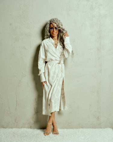 Printed Maxi Wrap-Dress This wrap dress drapes effortlessly, bringing an air of nonchalance that comes with knowing you don't have to try. A barely-there tonal print of oversized letters runs across the length of the fabric, creating a quiet contrast. Wea