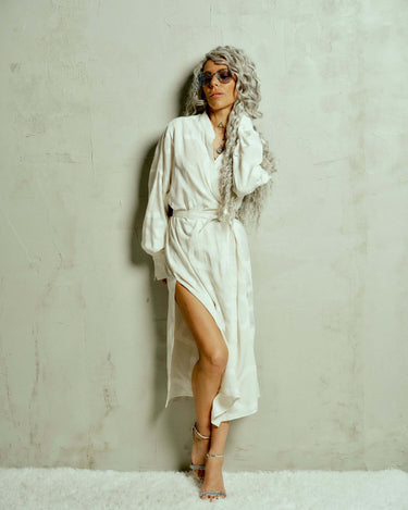 Printed Maxi Wrap-Dress This wrap dress drapes effortlessly, bringing an air of nonchalance that comes with knowing you don't have to try. A barely-there tonal print of oversized letters runs across the length of the fabric, creating a quiet contrast. Wea