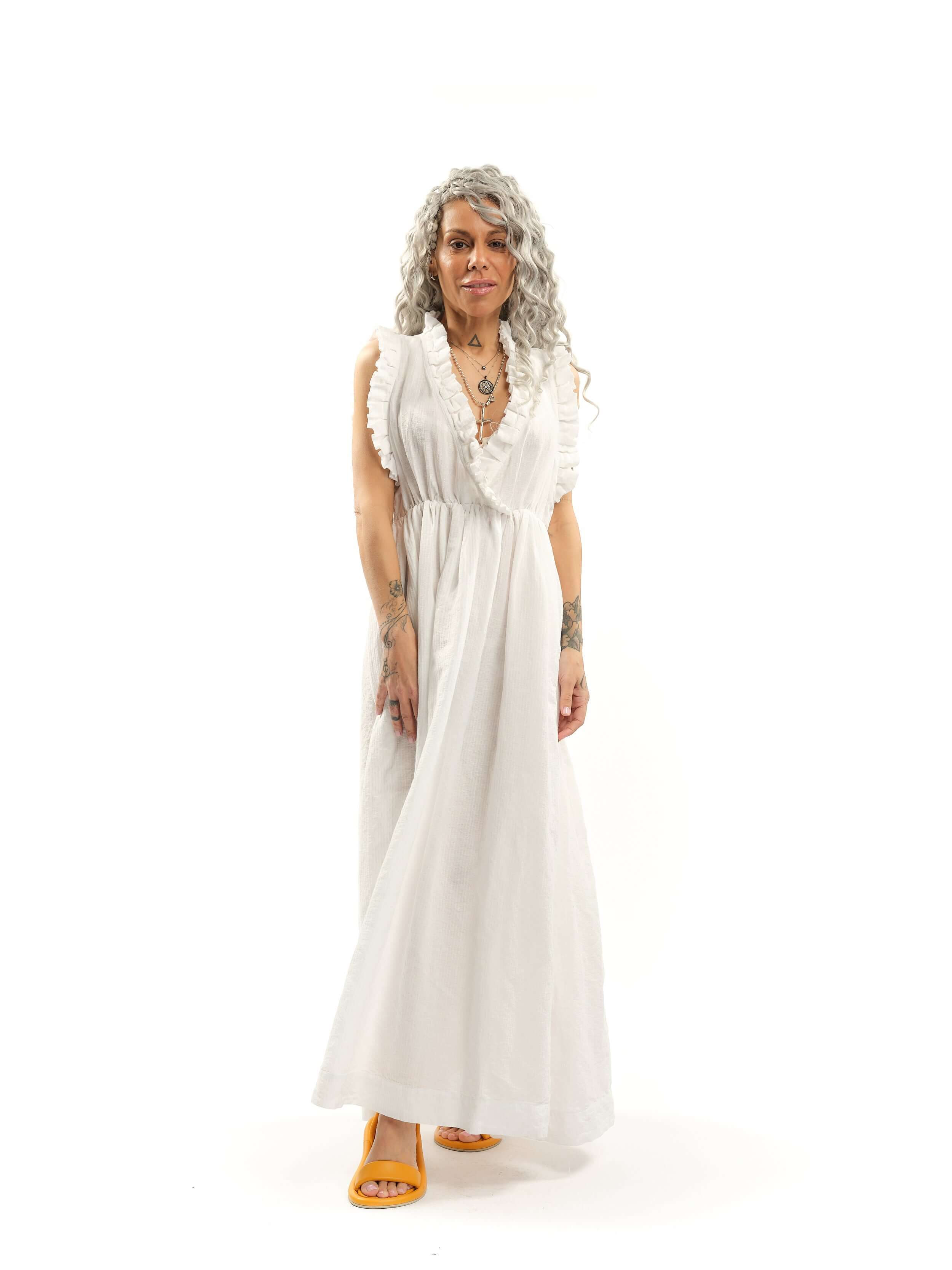 Ruffled Cotton-Blend Maxi Dress There’s something about ruffles that feels like pure romance. Cut from airy fabric, this dress moves with you, making every step feel like part of a story, one filled with golden afternoons, candlelit dinners, and the kind