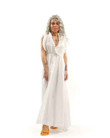 Ruffled Cotton-Blend Maxi Dress There’s something about ruffles that feels like pure romance. Cut from airy fabric, this dress moves with you, making every step feel like part of a story, one filled with golden afternoons, candlelit dinners, and the kind
