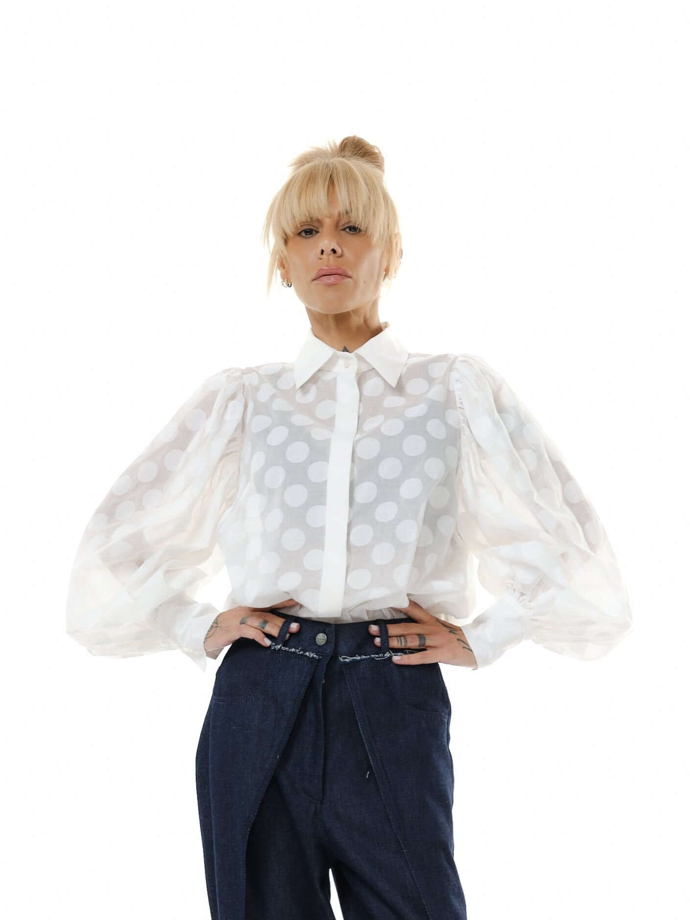 White sheer polka dot puff sleeve shirt with a pointed collar and voluminous sleeves, perfect for a sophisticated look.