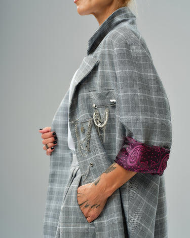 Light grey checked oversized blazer with decorative chain detail and burgundy paisley lining.