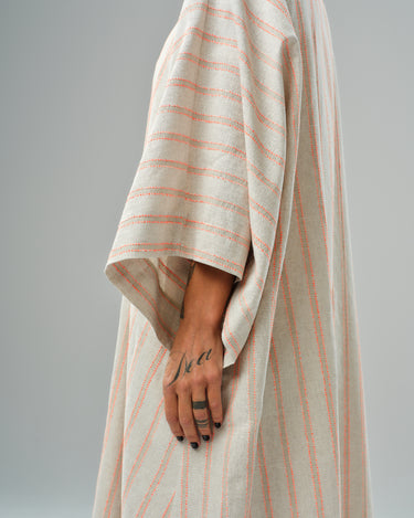 Side view of a lightweight striped linen-cotton kimono with relaxed silhouette and soft fabric.