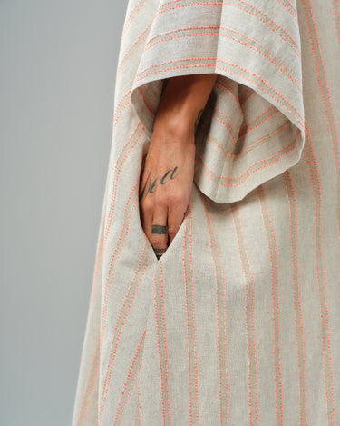 Handmade striped linen-cotton kimono with a relaxed fit, showcasing a pocket and soft drape.