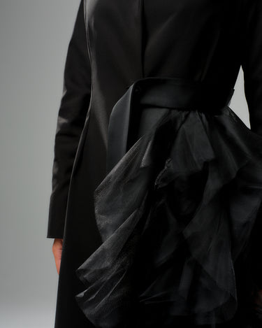 Black tulle detail blazer with asymmetric tulle accent and satin waist belt, showcasing bold evening wear style.