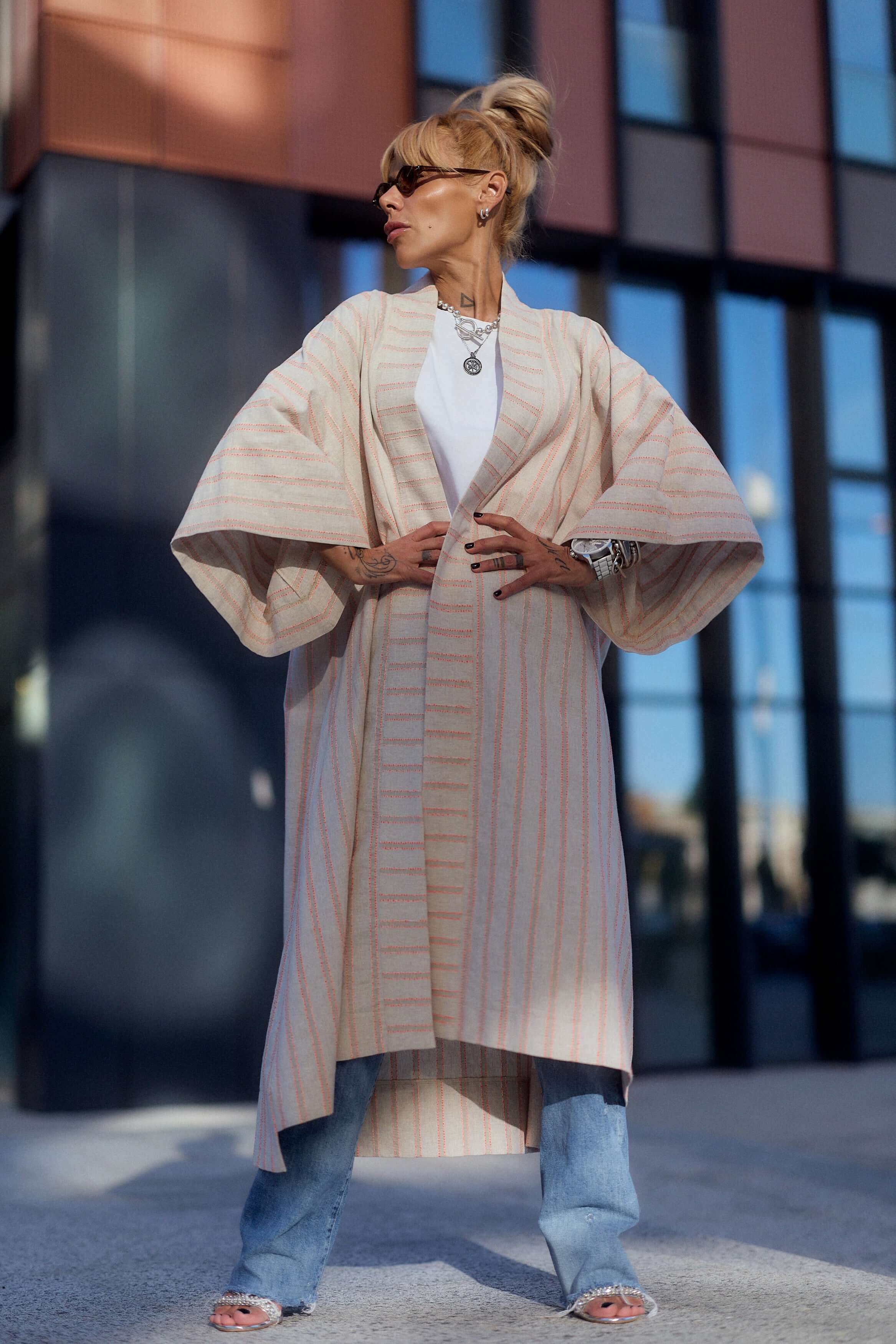 Model wearing a Striped Linen-Cotton Kimono over a casual outfit, showcasing its elegant drape and relaxed fit.