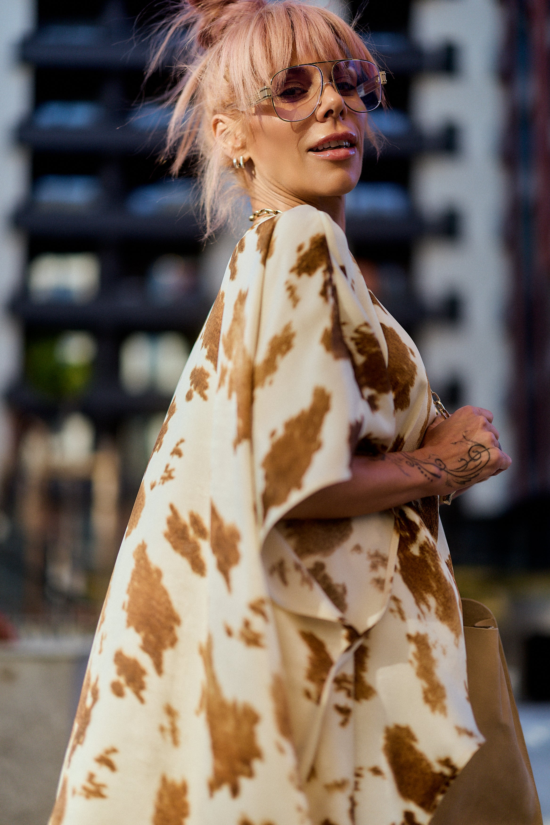 Beige Printed Asymmetric Tunic worn by a model with pink hair, showing an artistic camel abstract print and modern silhouette.