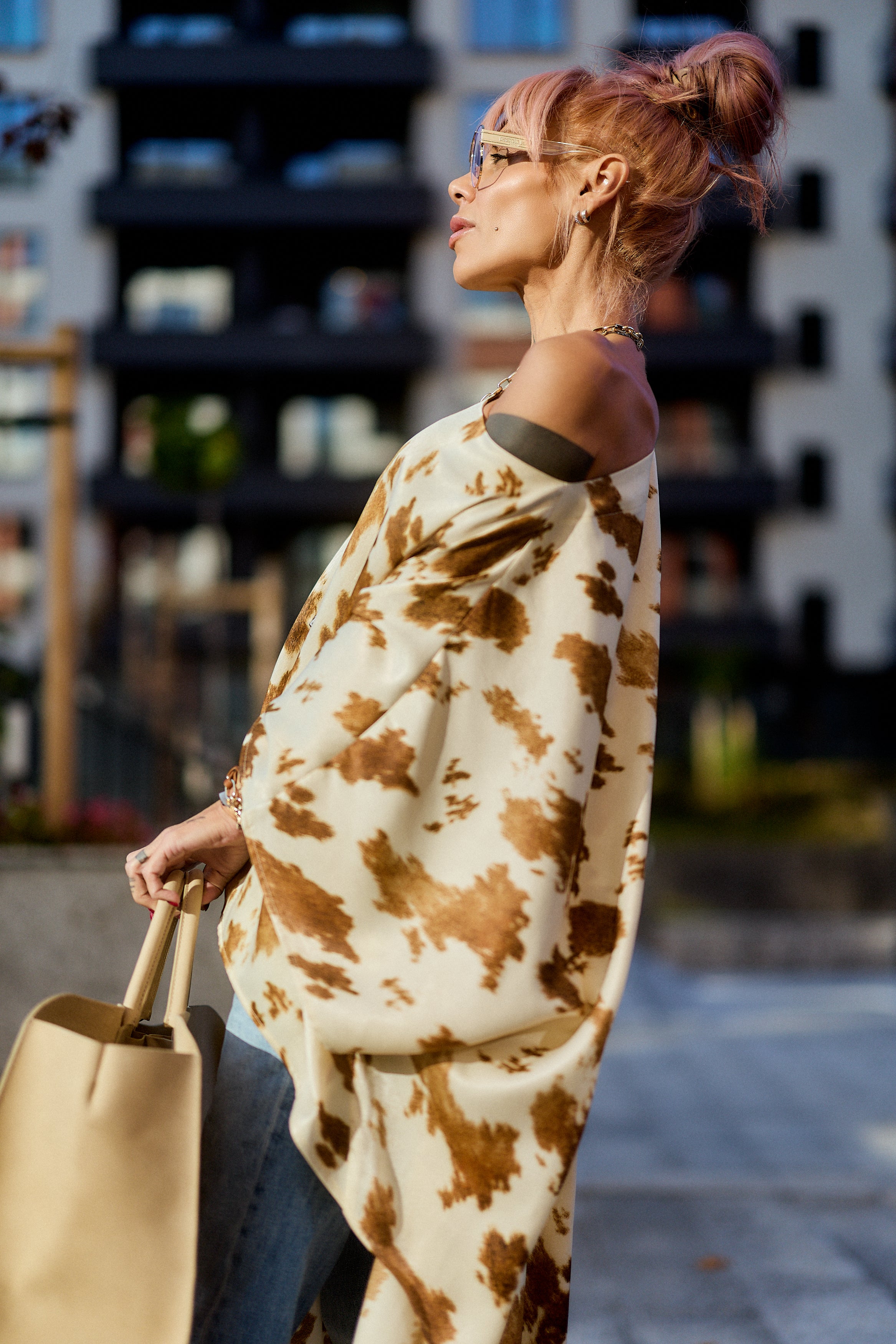 Beige Printed Asymmetric Tunic worn off one shoulder, featuring camel-toned abstract print and a stylish drape.