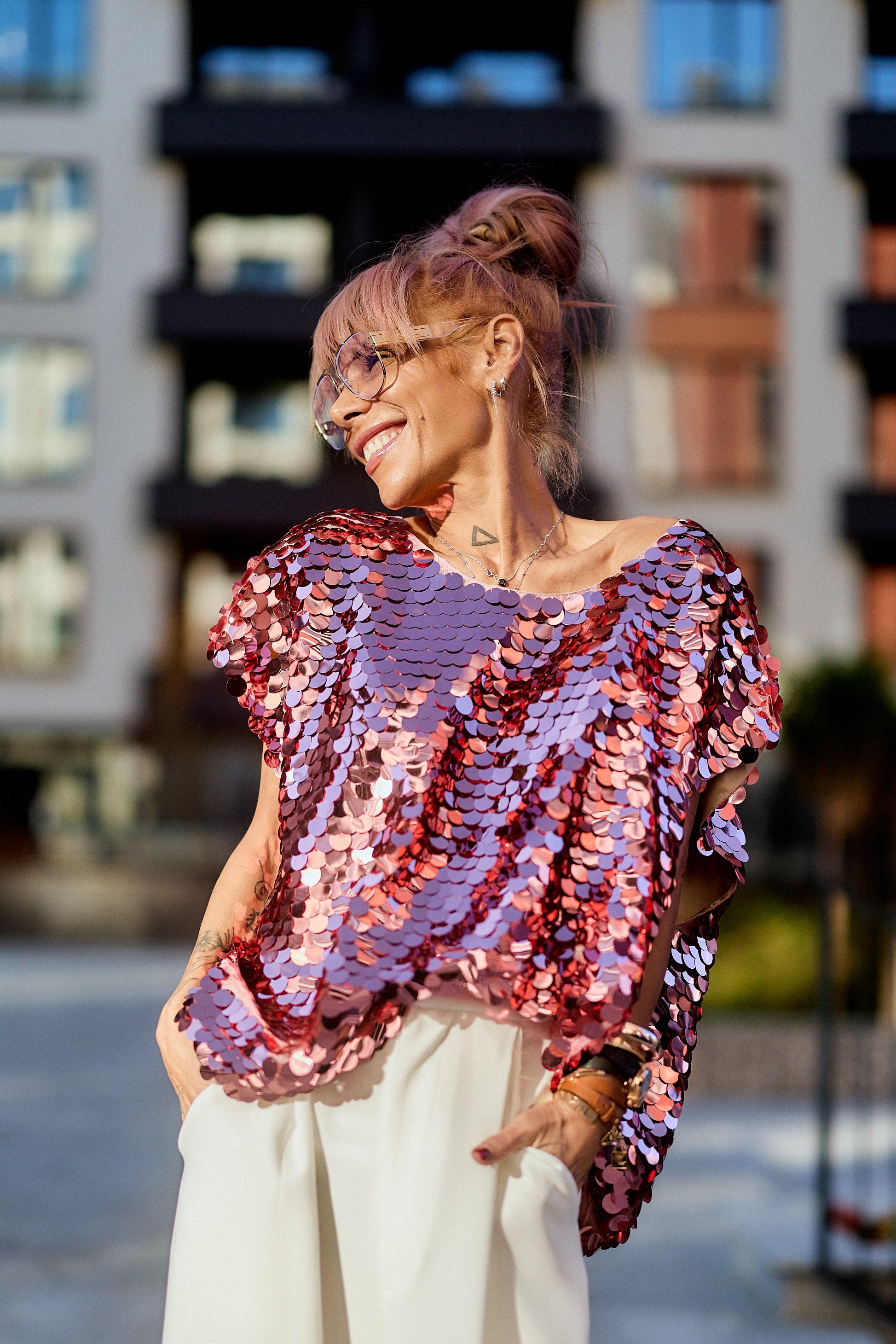 Model wearing a Pink Sequin Oversized Top, featuring luminous pink sequins and a relaxed silhouette.