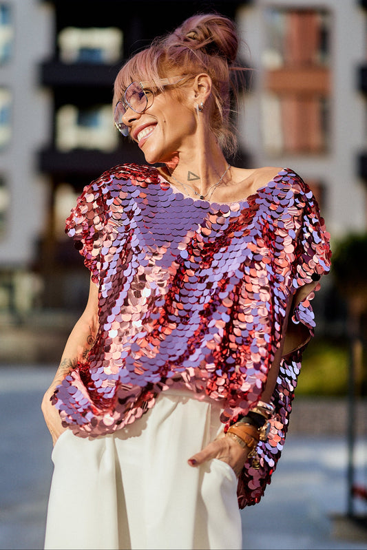 Model wearing a Pink Sequin Oversized Top, featuring luminous pink sequins and a relaxed silhouette.