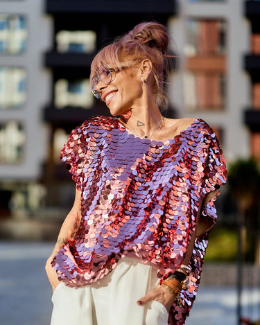 Model wearing a Pink Sequin Oversized Top, featuring luminous pink sequins and a relaxed silhouette.
