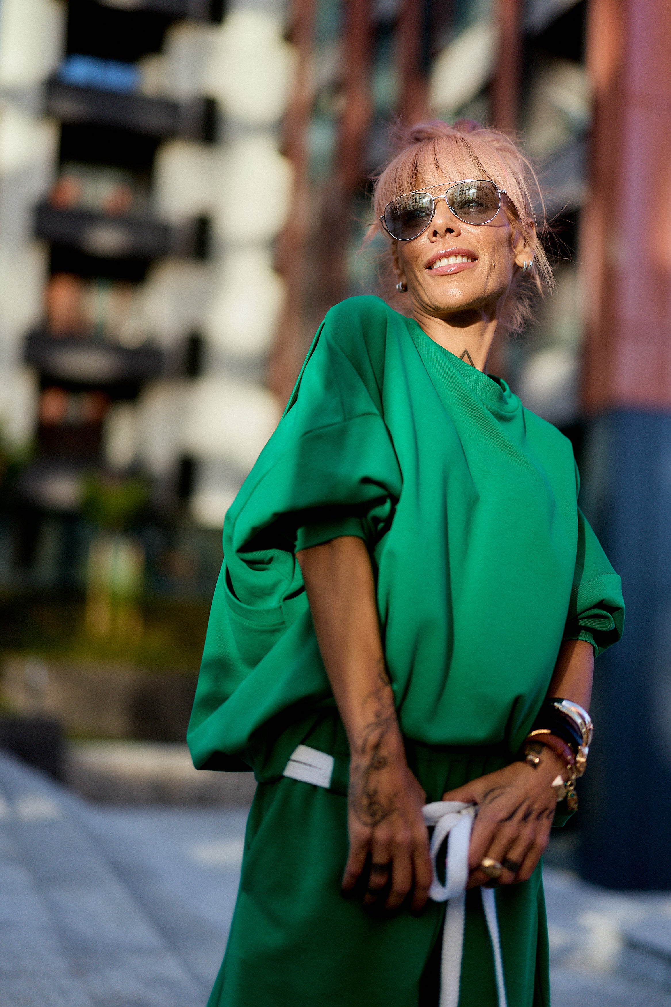 Green Oversized Sweat Set with Open Back featuring a relaxed fit and open-back detail against a stylish urban backdrop.