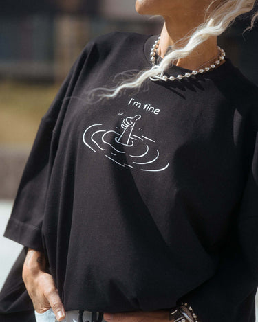 Black Oversized “I’m Fine” Graphic T-Shirt featuring a unique sinking gesture print.