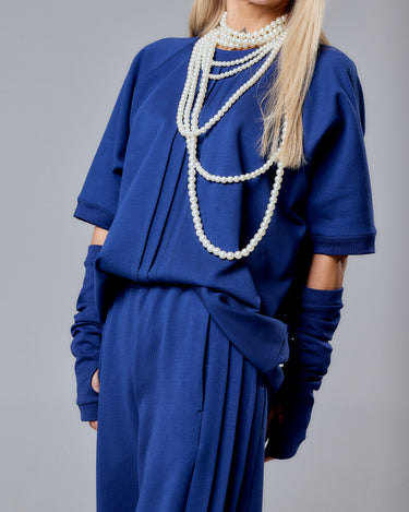 Navy Blue 3-Piece Set featuring a relaxed short-sleeved top, wide-leg pants, and fingerless gloves, styled with pearls.