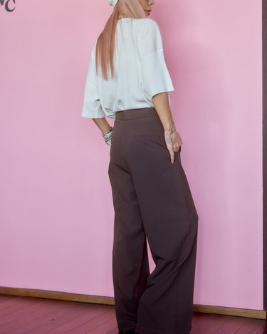Wide-Leg Tailored Pants in Dark Brown worn with a stylish top, showcasing a refined silhouette and comfortable fit.