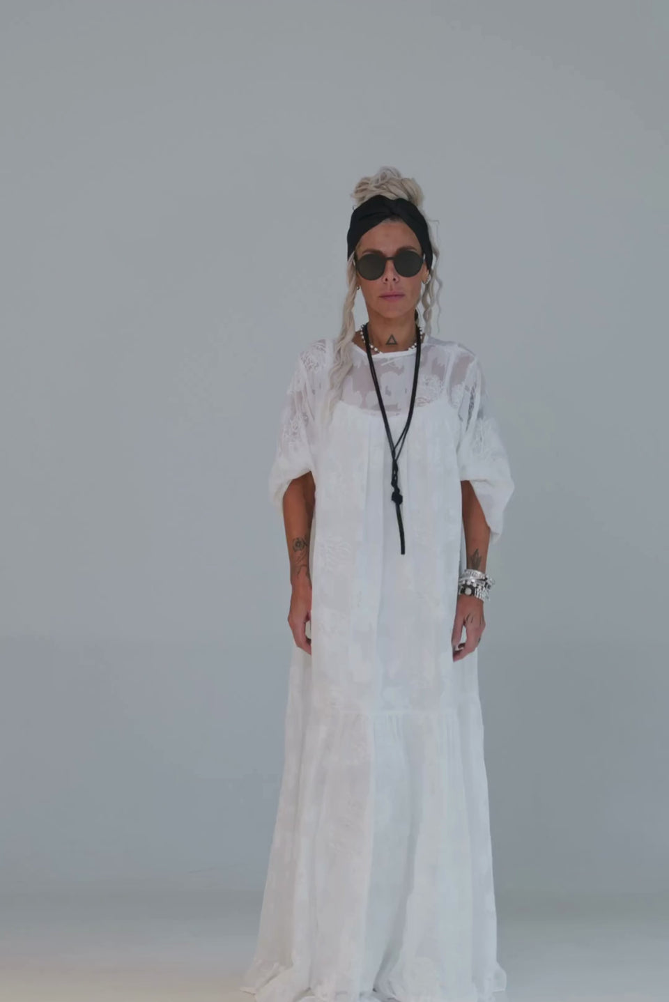 Ivory Sheer Embroidered Maxi Dress worn by a model, showcasing its lightweight sheer fabric and elegant design.