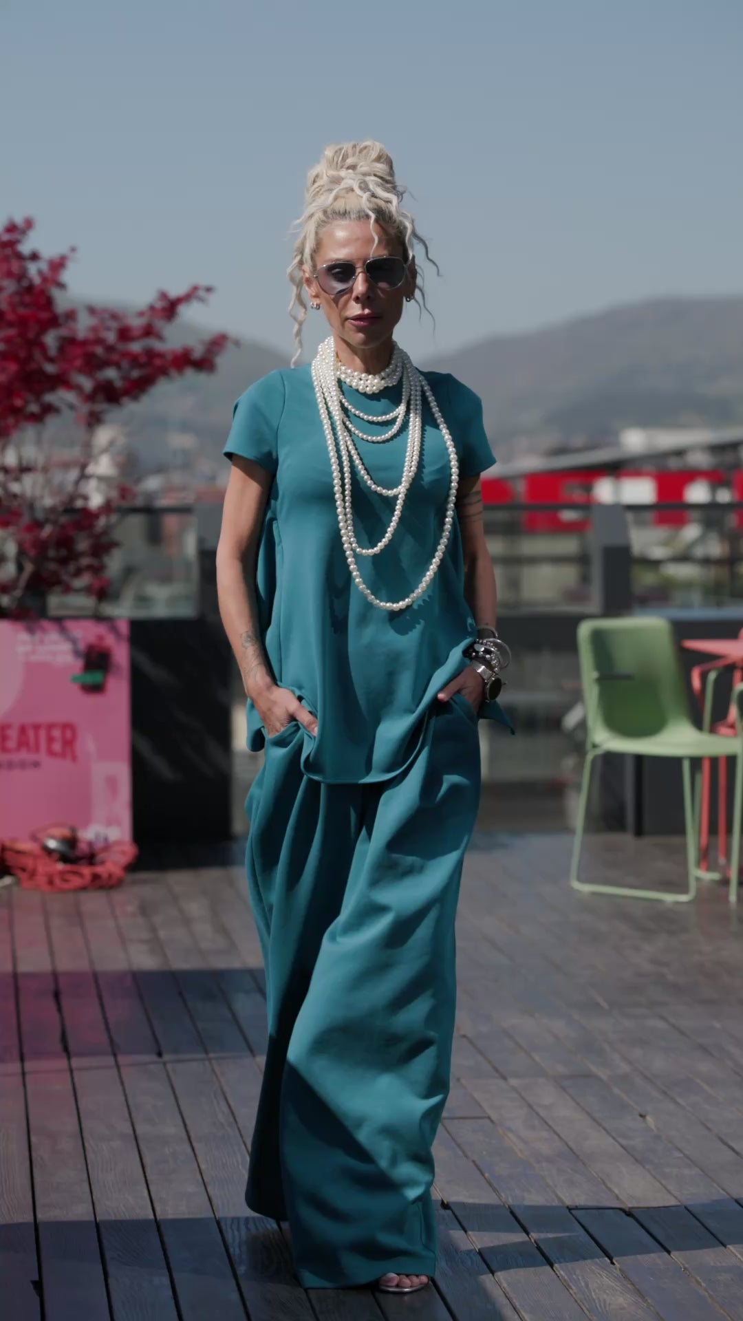Model showcasing the Bluel Open-Back Matching Set with a stylish open-back detail in a vibrant teal shade.