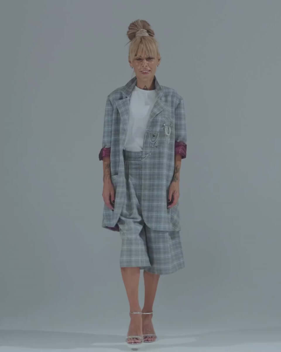 Light grey checked blazer and culotte co-ord set featuring oversized design and chic burgundy paisley lining.
