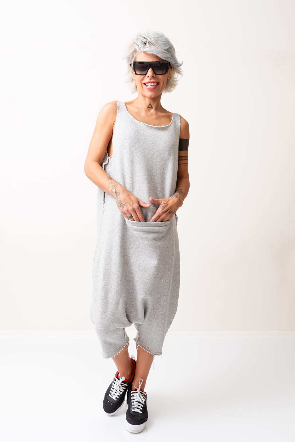 Grey Oversized Sleeveless Jumpsuit Paired with a Top with Long Sleeves - Clothes By Locker Room